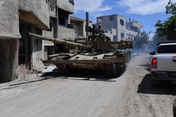 Un char syrien dans le camp Yarmouk (Sputnik)