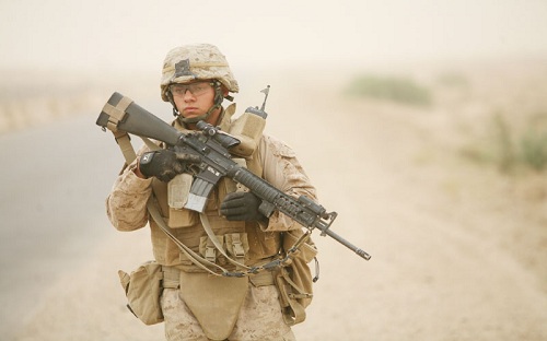 U.S. Marine Lance Cpl. Johnathan Bruch with 2nd Platoon, Alpha Company, 1st Battalion, 7th Marine Regiment, patrols down a street near Saqlawiyah, Iraq, May 31. U.S. Marines with A Co, 1/7 were conducting a local security patrol around Combat Outpost Viking.