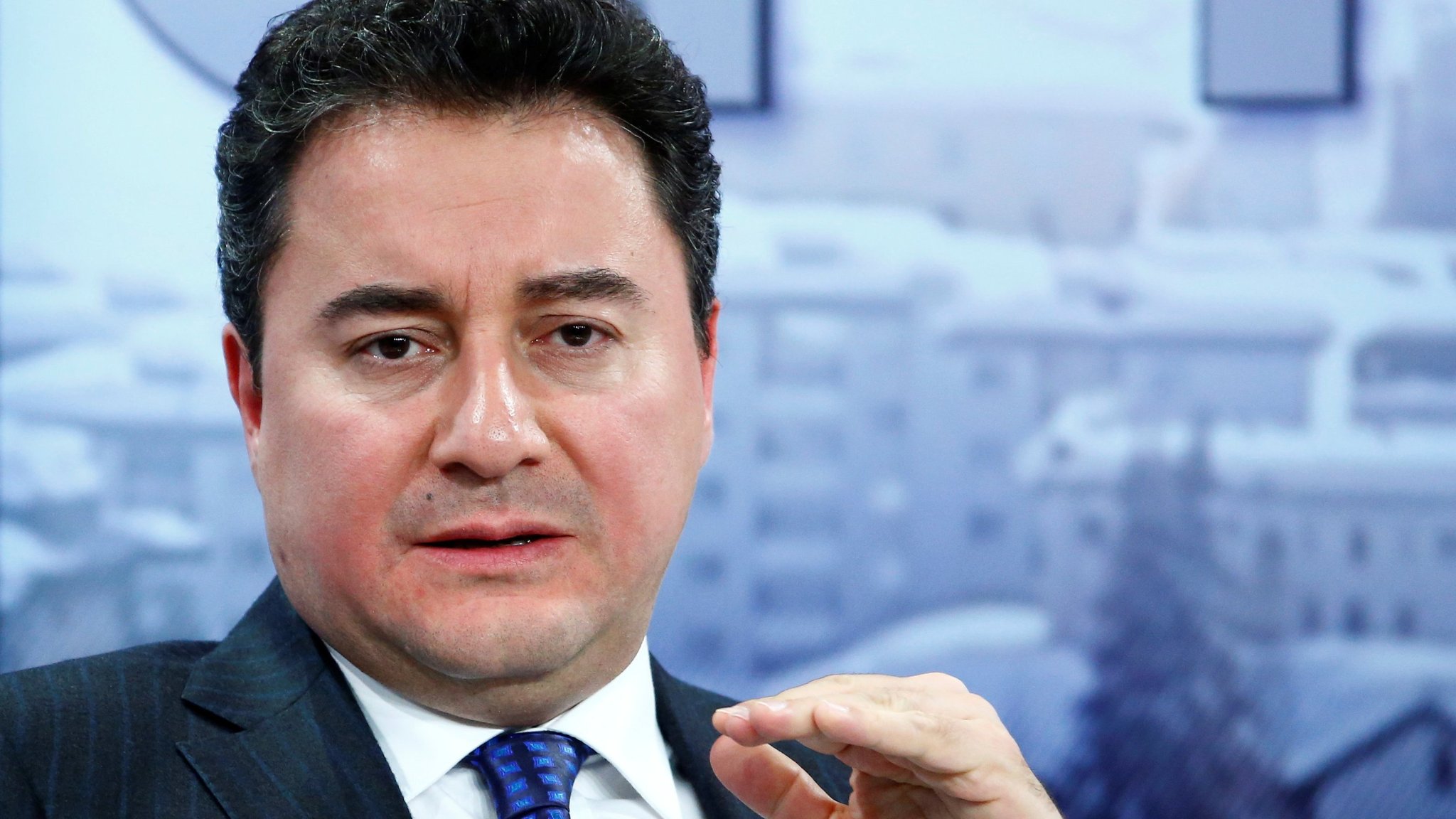 FILE PHOTO: Turkish Deputy Prime Minister Babacan gestures during the session 'Growing in Harder Times' in the Swiss mountain resort of Davos