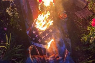 The statue of Christopher Columbus is seen on the ground after it was pulled down by protesters in Richmond