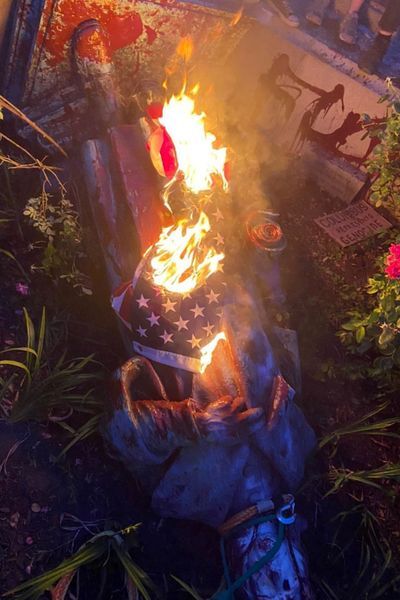 The statue of Christopher Columbus is seen on the ground after it was pulled down by protesters in Richmond