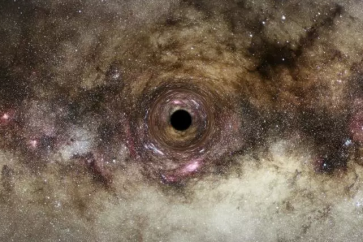 Vue d'artiste d'un trou noir qui courbe le trajet de la lumière passant à proximité, dans le phénomène de lentille gravitationnelle, dans une photo fournie par l'ESA le 10 juin 2022